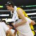 Michigan freshman Nik Stauskas is lifted in the air by teammate freshman Mitch McGary after Michigan beat Florida 79-59 to advance to the Final Four in Atlanta. Melanie Maxwell I AnnArbor.com